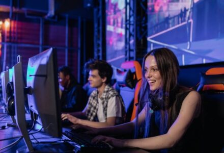 A group of young adults enjoying a gaming session in a vibrant esports arena. - A group of young adults enjoying a gaming session in a vibrant esports arena., tags: betting - pexel