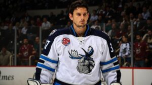 Connor Hellebuyck - Connor Hellebuyck Manitoba (cropped) - Digital concept art for illustrative purpose, tags: vezina - Monok