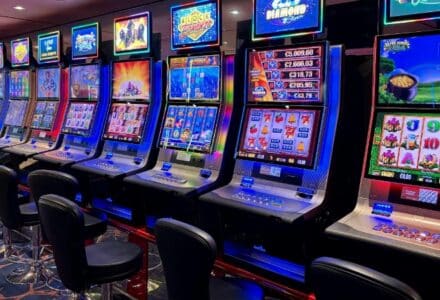 Bright casino slot machines with colorful displays and no people present., tags: playtech slots - pexel