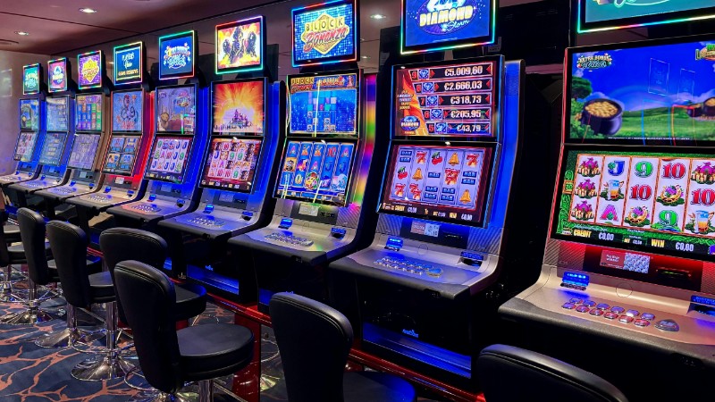 Bright casino slot machines with colorful displays and no people present., tags: playtech slots - pexel