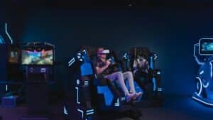 Adults enjoying a virtual reality gaming experience with VR headsets indoors., tags: canada's gambling - pexel