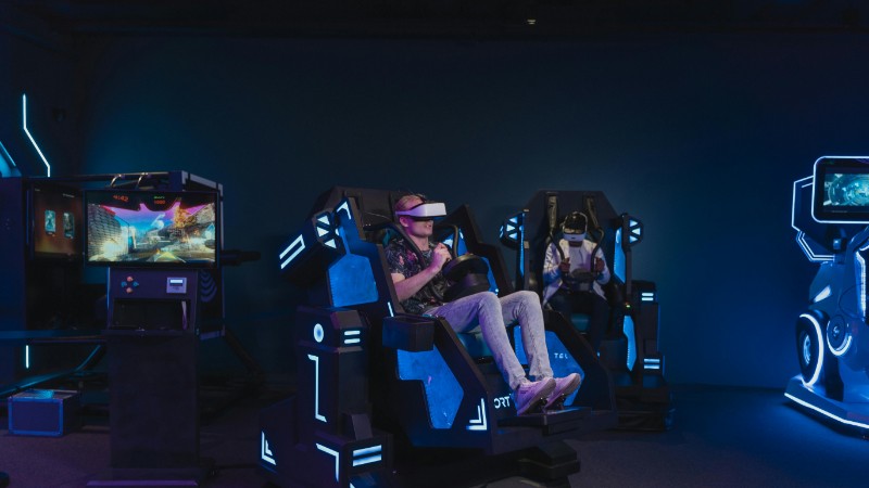 Adults enjoying a virtual reality gaming experience with VR headsets indoors., tags: canada's gambling - pexel