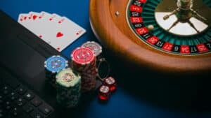 Close-up of a roulette table, poker chips, and playing cards depicting casino culture., tags: ruby fortune - pexel